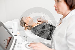 Doctor making ultrasound examination to a young woman