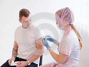 Doctor making a vaccination in the shoulder of patient