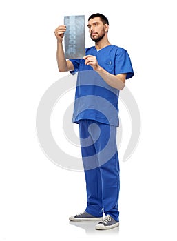 doctor or male nurse looking at x-ray scan