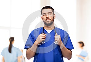 doctor or male nurse with stethoscope