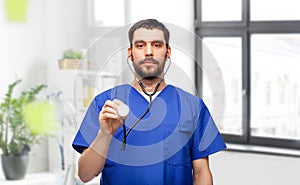 doctor or male nurse with stethoscope