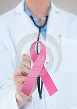 Doctor man with breast cancer awareness ribbon