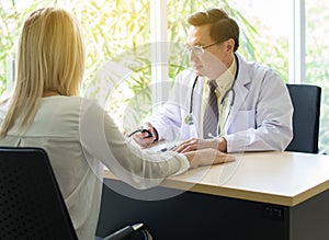 Doctor man checking to her patient blood pressure in hospital,Heart rate pressure gauge