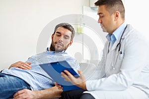 Doctor and man with health problem at hospital