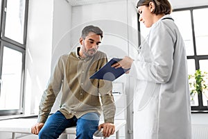 doctor and man with health problem at hospital