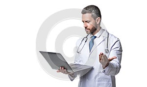 doctor man with laptop, copy space. doctor promoting ehealth isolated on white. doctor offering ehealth in studio