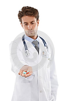 Doctor, man and prescription of pills in studio, wellness medication and healthcare in pharmaceuticals. Pharmacist, face