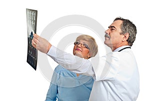 Doctor man review MRI with patient woman