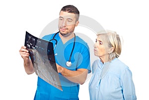 Doctor man showing MRI to his senior patient