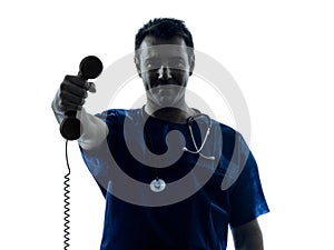 Doctor man silhouette holding phone