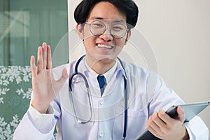 Doctor man smile raise hands to greet patients modern smart digital tablet computer