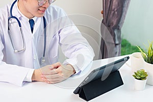 Doctor man smile using black modern smart digital tablet computer