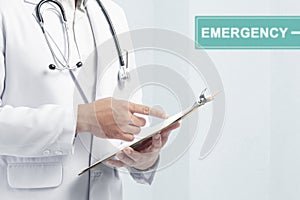 Doctor man with stethoscope holding a clipboard on the emergency room