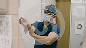 Doctor man surgeon male physician in uniform washing hands in hospital clinic disinfect antibacterial medical sterile