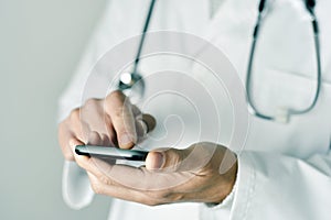 Doctor man using a smartphone