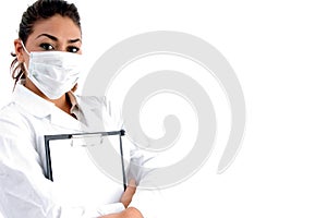 Doctor with mask on her face and writing board