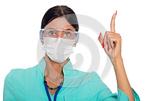 Doctor in a mask with a warning gesture