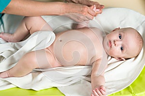 Doctor massaging baby