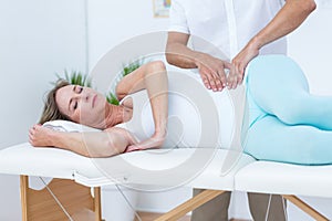 Doctor massaging his patient stomach