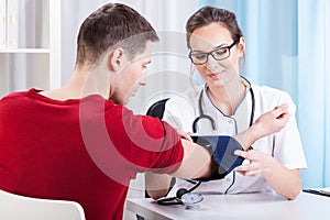 Doctor measuring blood pressure