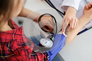 Doctor measuring blood pressure