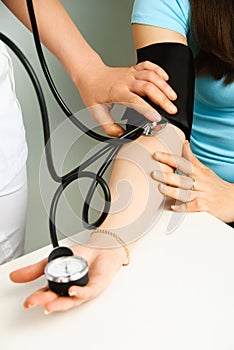 Doctor measuring blood pressure