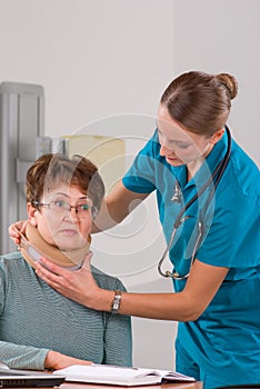 Doctor measuring neck bandage