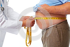 Doctor measuring obese man stomach.