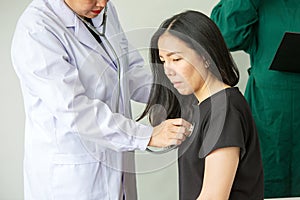 The doctor is measuring the patient`s pulse. Female medical doctor examining her patient. doctor measuring blood pressure of wome