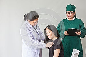 The doctor is measuring the patient`s pulse. Female medical doctor examining her patient. doctor measuring blood pressure of wome