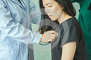 The doctor is measuring the patient`s pulse. Female medical doctor examining her patient. doctor measuring blood pressure of wome