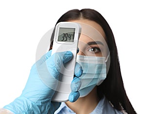 Doctor measuring woman`s temperature on white background, closeup. Prevent spreading of Covid-19