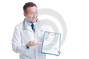 Doctor or medic presenting medicine sales and financial prediction charts