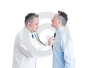 Doctor or medic using stethoscope on his doppelganger photo