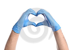 Doctor in medical gloves making heart with hands on white background, closeup