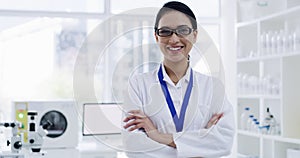 Doctor, medical or healthcare professional working in laboratory specializing in medicine. Smiling, happy and confident