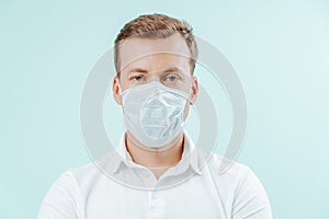 Doctor in medical mask in clinic on light blue background. Healthy concept