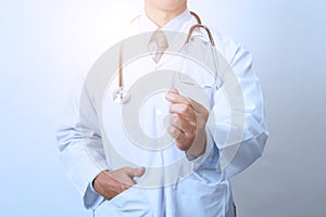 Doctor, medical professional holding something in empty hand