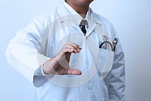 Doctor, medical professional holding something in empty hand