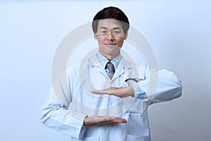 Doctor, medical professional holding something in empty hand