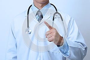 Doctor, medical professional pointing something in empty hand