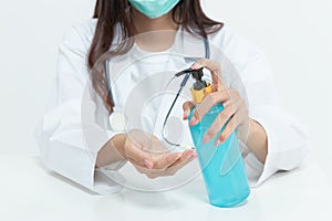 Doctor and medical staff washing hand by hand sanitizer alcohol gel for cleaning, hygiene and disinfection, prevent of spreading photo