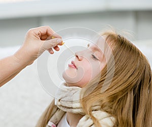 Doctor medication drips into the nose girl