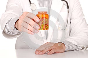 Doctor With Medication in Prescription Bottles