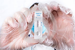 Doctor or medtech shows rapid laboratory COVID-19 test