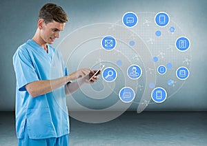 Doctor with a mobile phone with apps against grey background