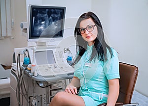 Doctor near ultrasound equipment. Diagnostics and sonography