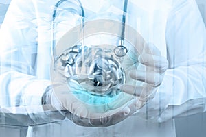 Doctor neurologist hand show metal brain photo