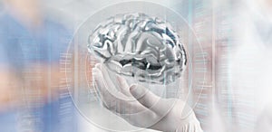 Doctor neurologist hand show metal brain photo