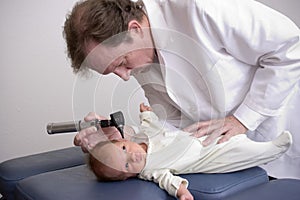 Doctor with a newborn baby